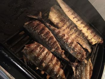 High angle view of meat on barbecue