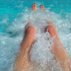 Low section of person in swimming pool