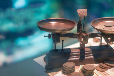 High angle view of weight scale with money on table