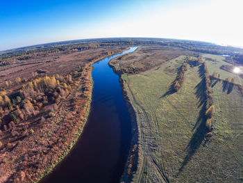 Aerial view of landscape and sea against sky