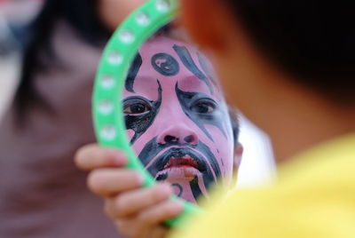 Close-up of boy wearing carnival costume