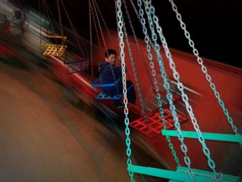 View of man on rope at night