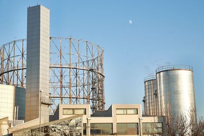 Low angle view of built structure against clear blue sky