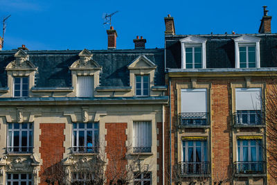 Low angle view of building against blue sky