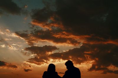 Silhouette of man against sky during sunset