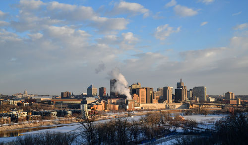 Buildings in city against sky