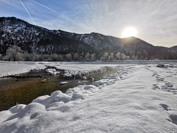 Scenic view of snowcapped mountains against sky during winter