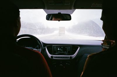 Rear view of man in car