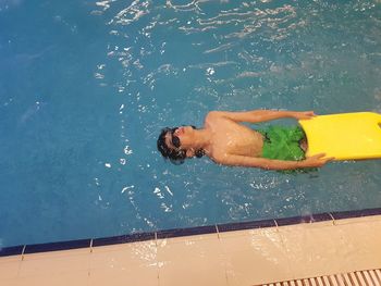 High angle view of man swimming in pool