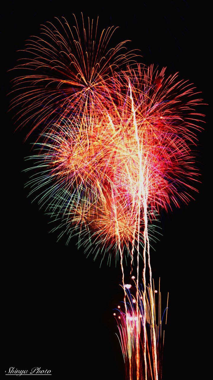 firework display, celebration, firework - man made object, exploding, night, sparks, low angle view, multi colored, long exposure, illuminated, event, motion, arts culture and entertainment, no people, blurred motion, firework, sky, outdoors, black background