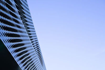 Low angle view of modern buildings against clear sky