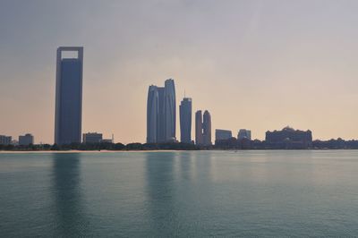 Modern buildings in city against sky