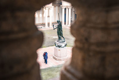 Statue in front of historic building