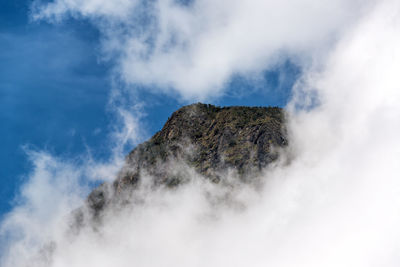 Clouds surrounding mountain