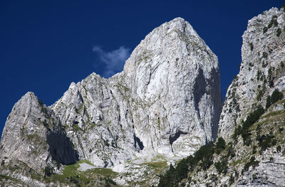 Low angle view of rock formation against sky