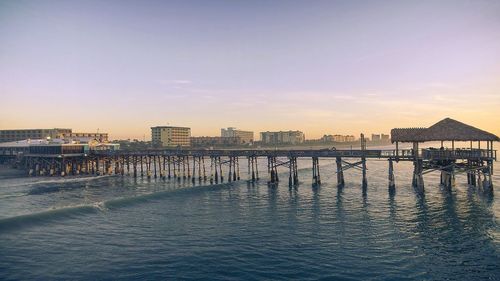 Scenic view of sea against clear sky during sunset