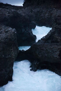 Scenic view of rocks in sea during winter