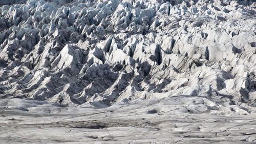 Full frame shot of rocks on snow covered landscape