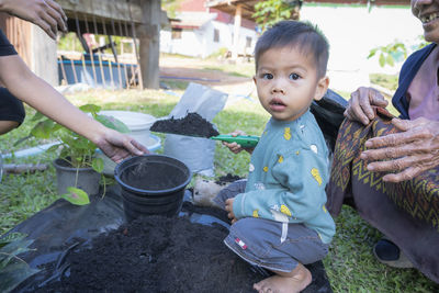 Side view of boy preparing food