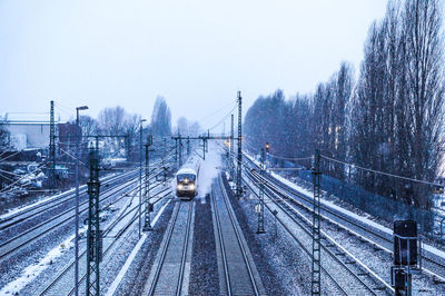 High angle view of railroad tracks against clear sky during winter