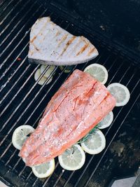 High angle view of meat on barbecue grill
