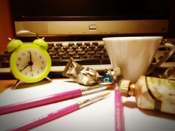 Close-up of clock on table