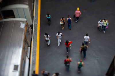 High angle view of people walking on road