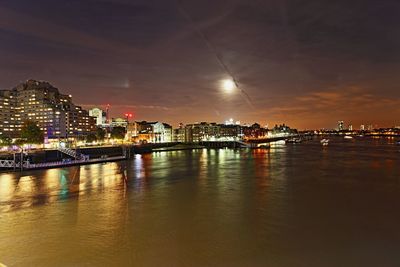 Reflection of illuminated buildings in water at night