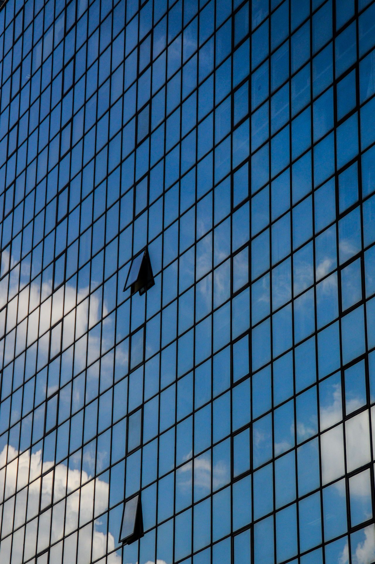 Building reflecting the clouds