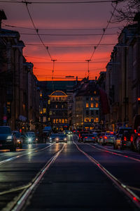 View of city street at sunset