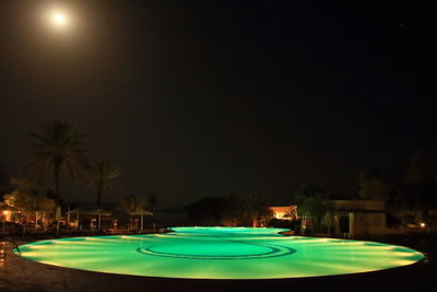 Empty swimming pool against blue sky