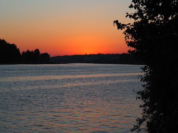 Scenic view of sea against orange sky