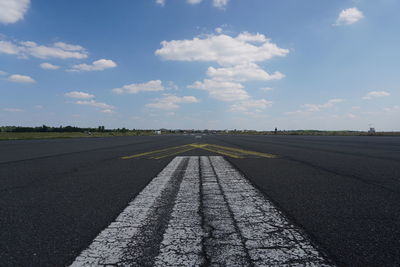 Empty road against sky