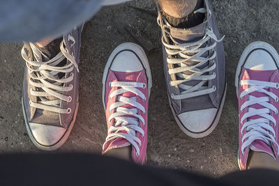 Low section of man standing on tiled floor
