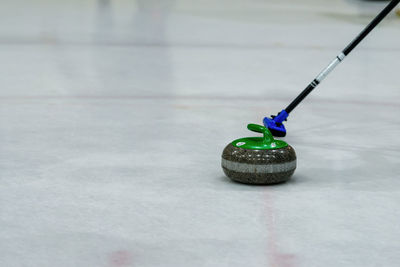 Close-up of curling stone on ice rink