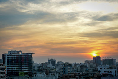 Cityscape against sky during sunset