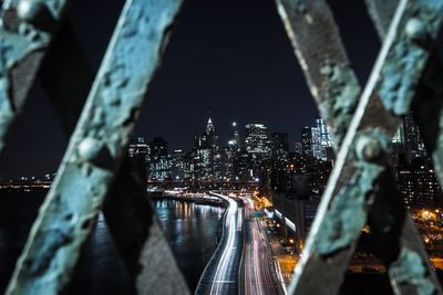 Aerial view of city lit up at night