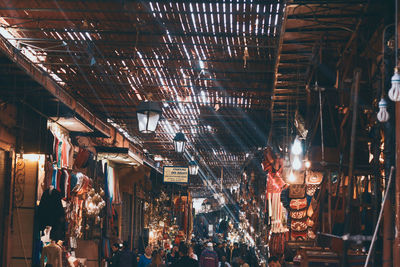 Crowd in illuminated market at night