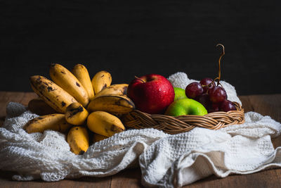 Close-up of apples in basket on table