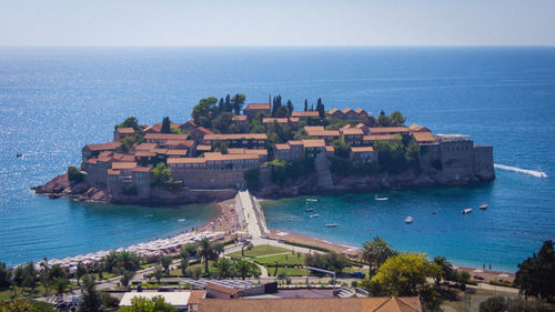 Sveti stefan amidst adriatic sea against sky