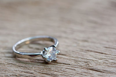 Close-up of wedding rings on table