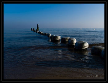 Scenic view of sea against clear sky