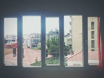 Buildings seen through glass window