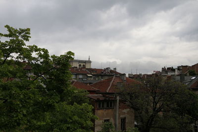 High angle view of town against cloudy sky