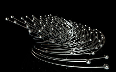 Close-up of illuminated lighting equipment against black background