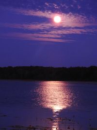 Scenic view of sea against sky at night