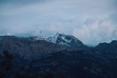 Scenic view of mountains against sky during winter