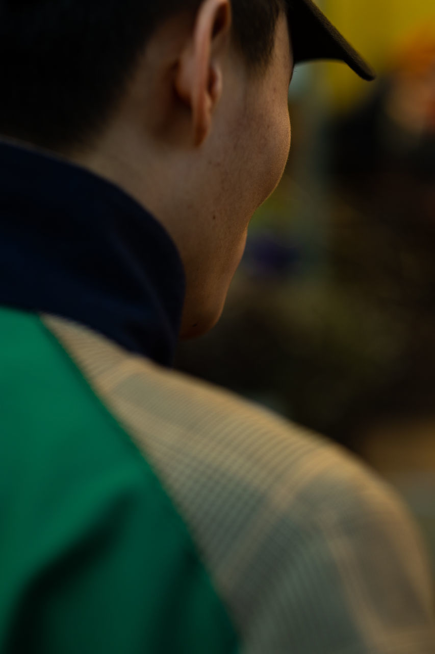 one person, real people, headshot, lifestyles, selective focus, men, leisure activity, portrait, young adult, close-up, focus on foreground, males, day, boys, side view, casual clothing, adult, looking, contemplation