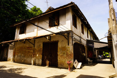 Man walking on street amidst buildings in city