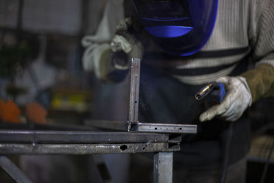 Man working on metal grate